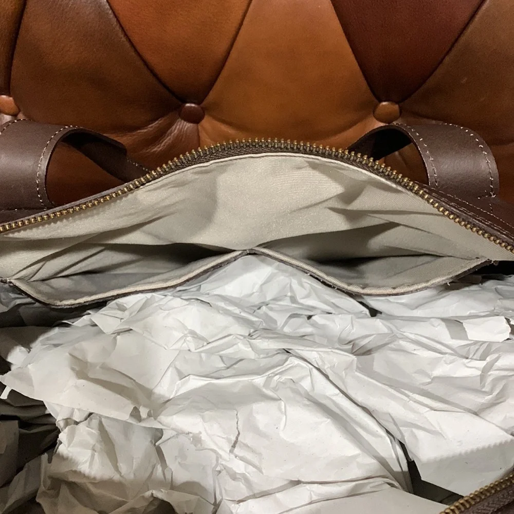 In Pell leather Duffel bag. Color: Brown, Made in Italy